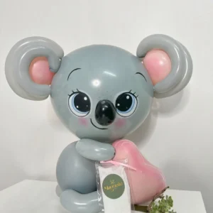 Grey balloon koala holding a pink heart, cute balloon animal sculpture for kids’ parties and baby showers