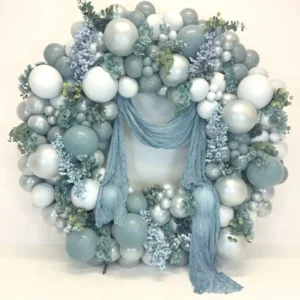 Grey and white balloon wreath with floral details, elegant balloon decoration for weddings and luxury events